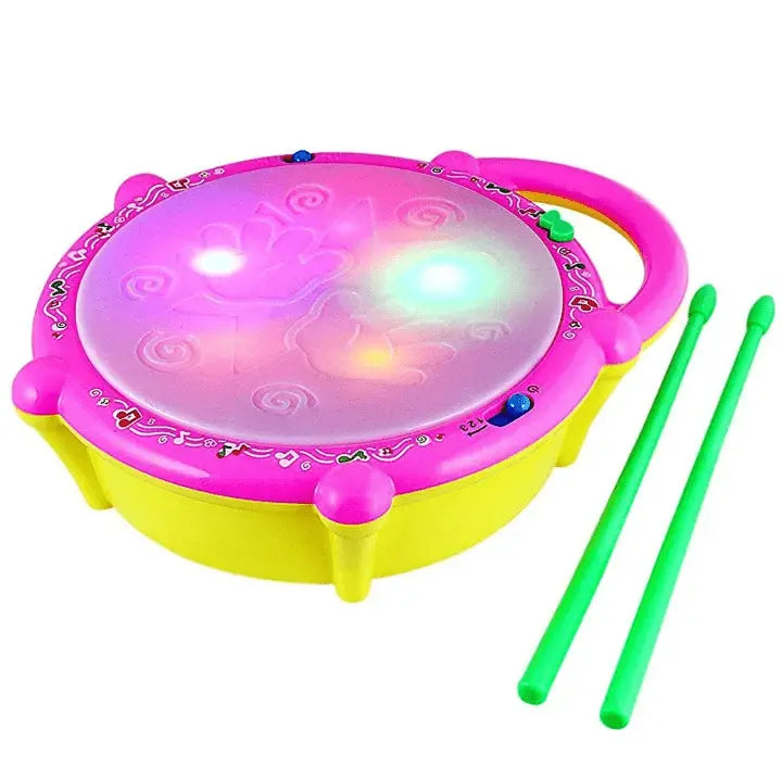 Child playing with musical flash drum and drumsticks