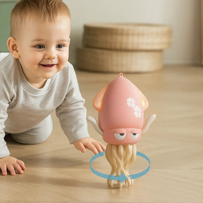 Child playing with a pink toy octopus on a wooden floor