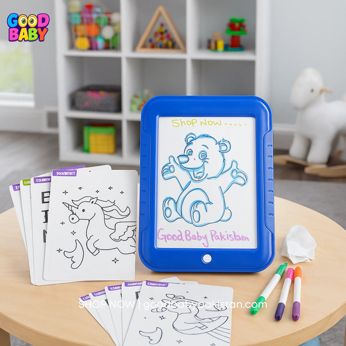 Blue electronic coloring board with coloring sheets and markers on a table in a child's room.