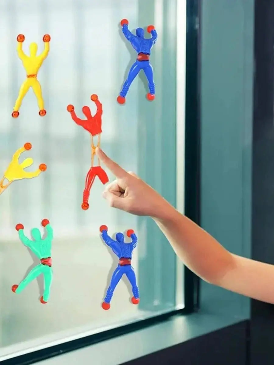 Stretchy sticky Spiderman toy clinging to wall