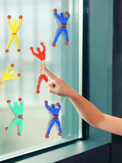 Stretchy sticky Spiderman toy clinging to wall