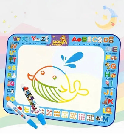 Children's drawing mat with colorful letters and symbols, featuring a whale drawing.