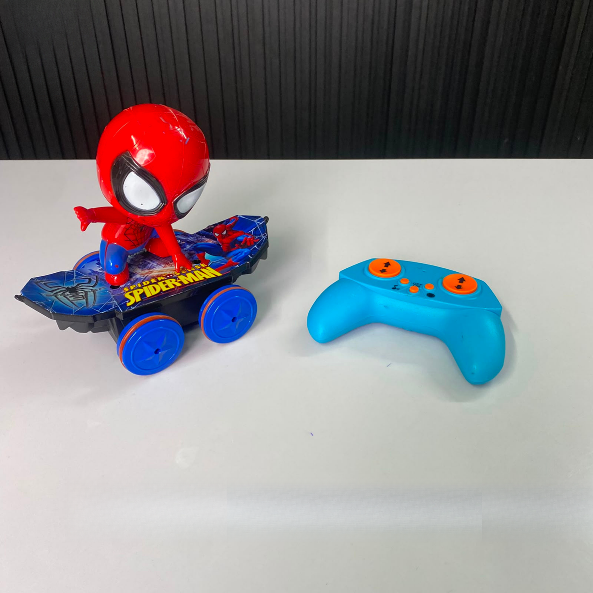 Superhero RC skateboard toy with blue remote control