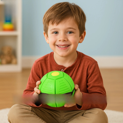 Child holding a green ball in a room with toys in the background